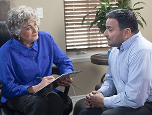 Man talking to therapist.